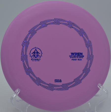 Stokely Discs Strato Wren spinning perfectly toward the basket at Deerfield Park Disc Golf Course in Mount Pleasant, Michigan.