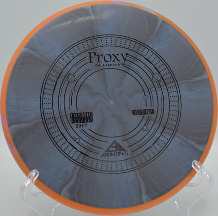 Axiom Cosmic Electron Soft Proxy putter holding a clean turnover line on a wooded approach at Lake Marshall Disc Golf Course in Montross, Virginia