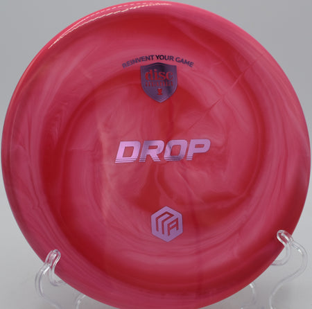 Swirl S-Line Drop Creator Series disc launched on a smooth turnover line at DeLaveaga Disc Golf Course in Santa Cruz, California