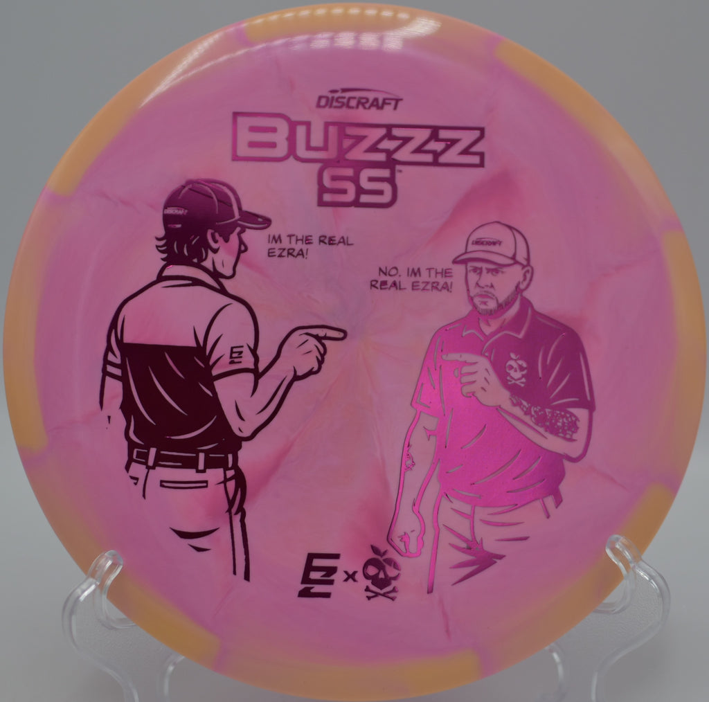 2025 ESP Buzzz SS collab shot floating past pines at Pine Hills Disc Golf Course in Laingsburg, Michigan.