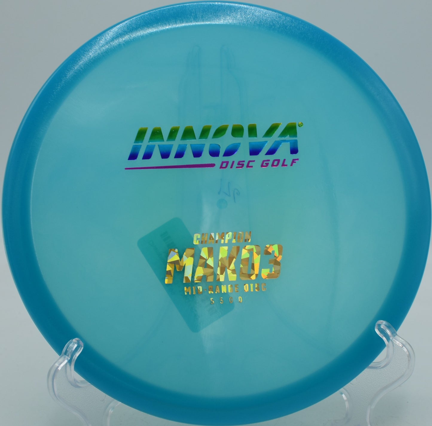 Disc golfer threading a gap with the Champion Mako3 at Hornets Nest in Charlotte, NC