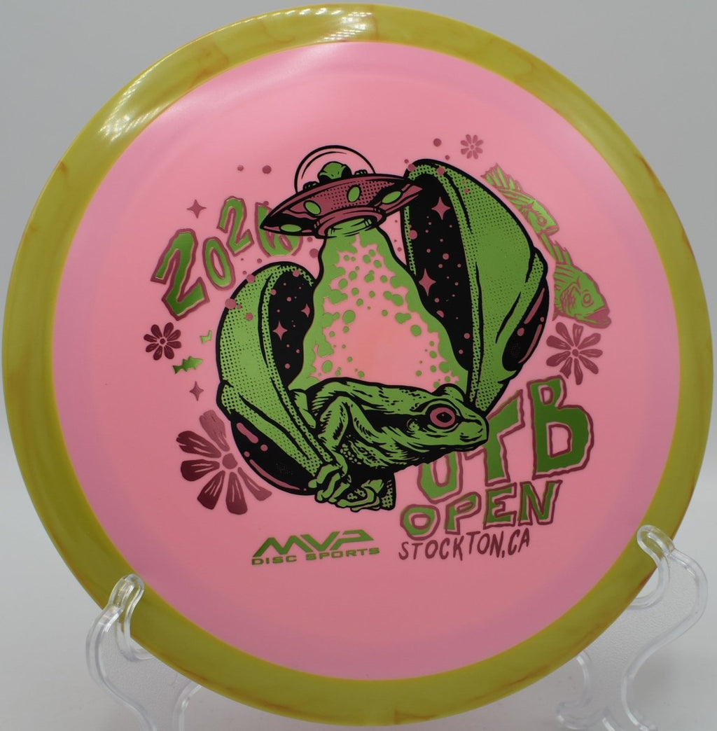 OTB Open 2026 Fission Delirium high-speed driver sitting on tee pad at Renny Gold Disc Golf Course in Charlotte, North Carolina