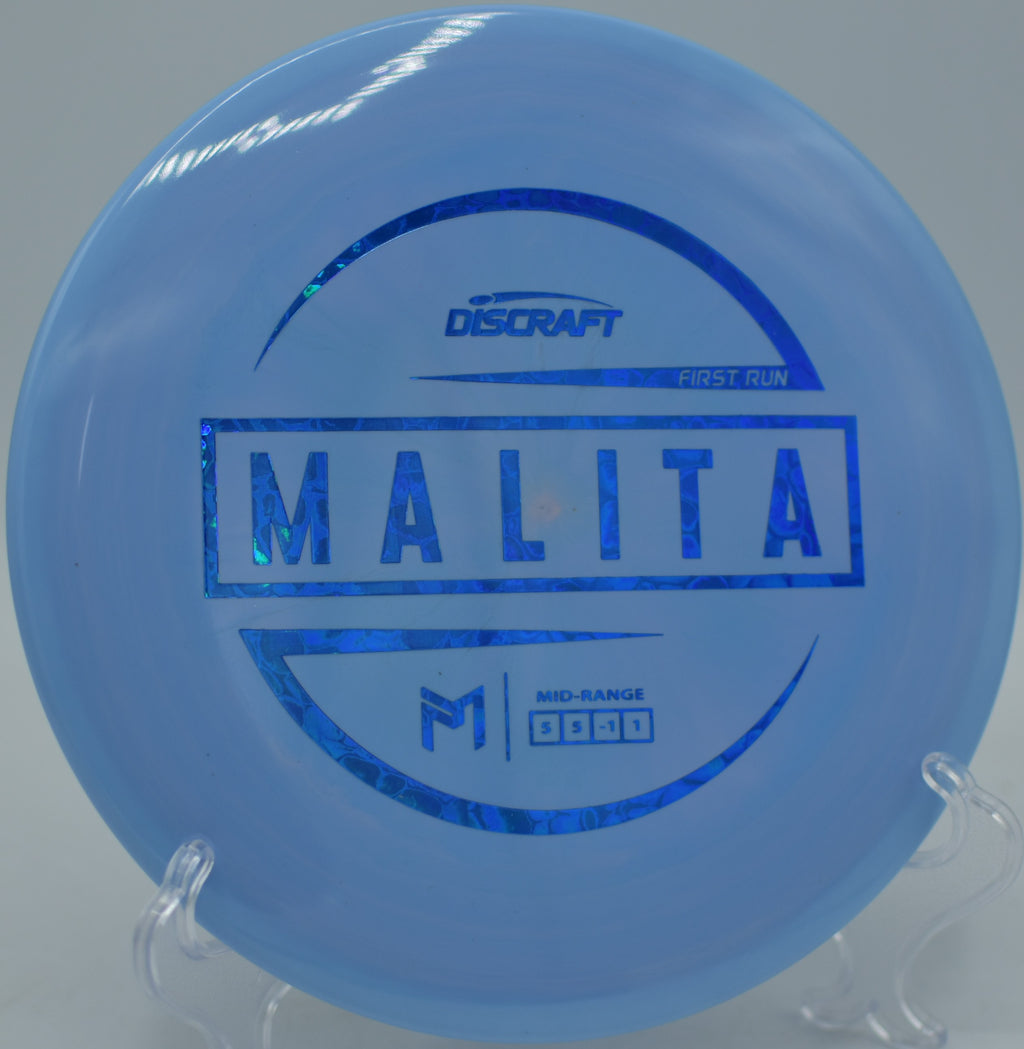First Run Discraft ESP Malita landing softly near the pin after a technical approach at Morley Field Disc Golf Course in San Diego, California.