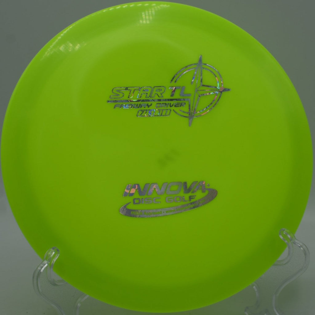 Star TL fairway driver staged for a straight tunnel drive at North Park Disc Golf Course in Haltom City, Texas