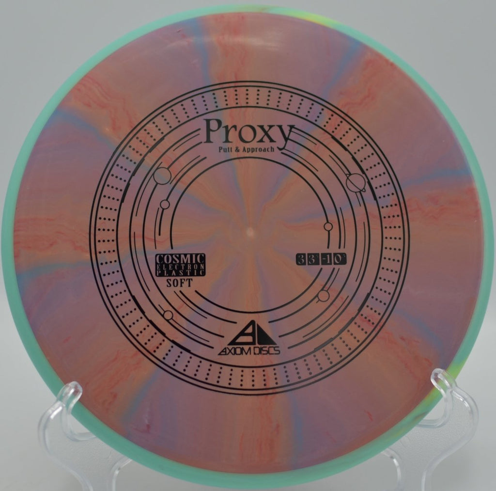 Axiom Cosmic Electron Soft Proxy delivering confident grip and straight flight on a finesse putt at Sunset Lakes Disc Golf Course in Hudson, Florida