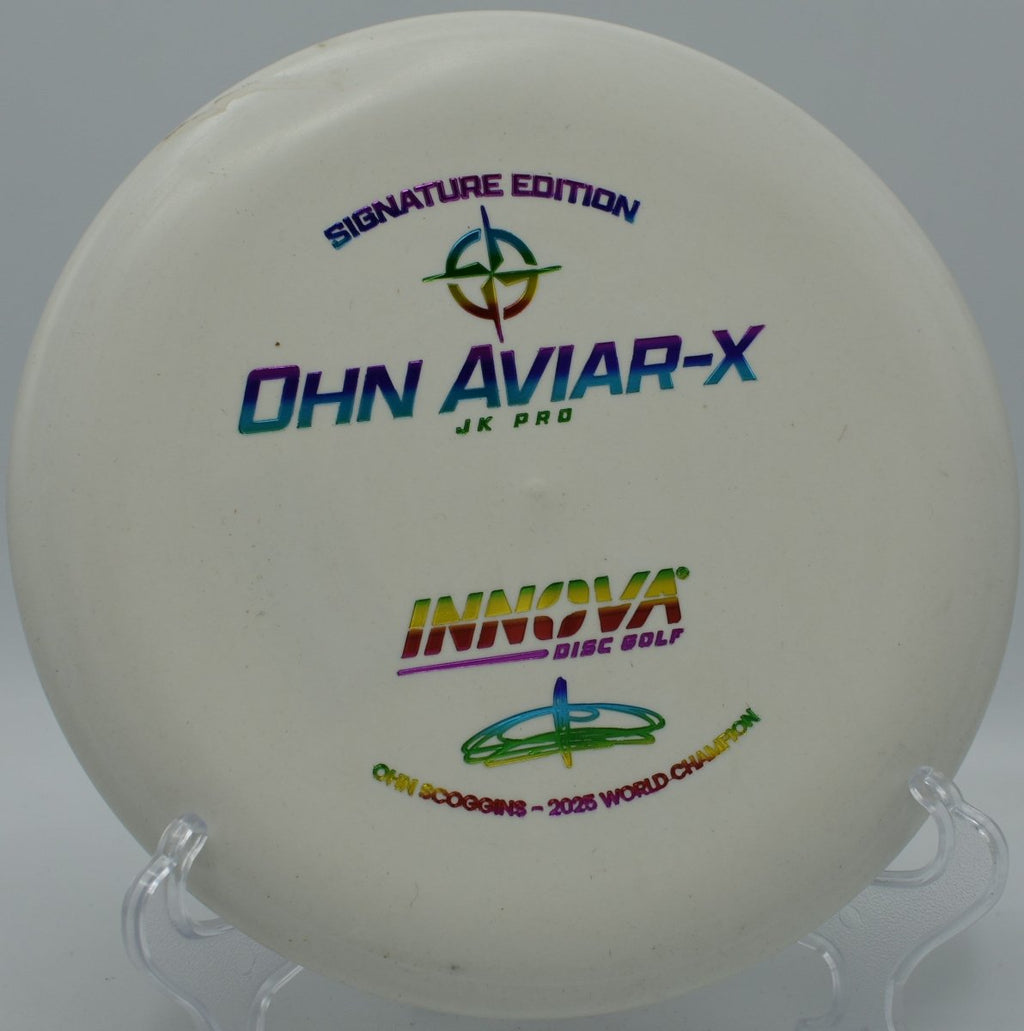 Innova JK Aviar-X putter sitting on the putting green ready for a tap-in putt at Milo McIver State Park Disc Golf Course in Estacada, Oregon