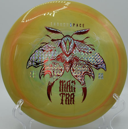 Mantra fairway driver gliding on a long turnover line through wooded fairway at Hickory Hills Disc Golf Course in Traverse City, Michigan