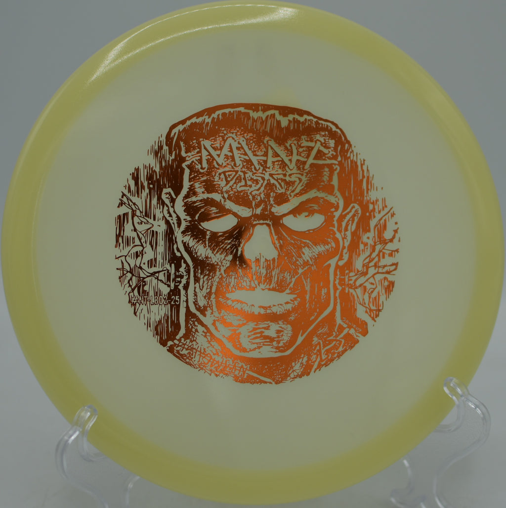 Halloween edition Nocturnal Lobster glowing orange and green during a night round at Fountain Hills Disc Golf Course in Fountain Hills, Arizona.