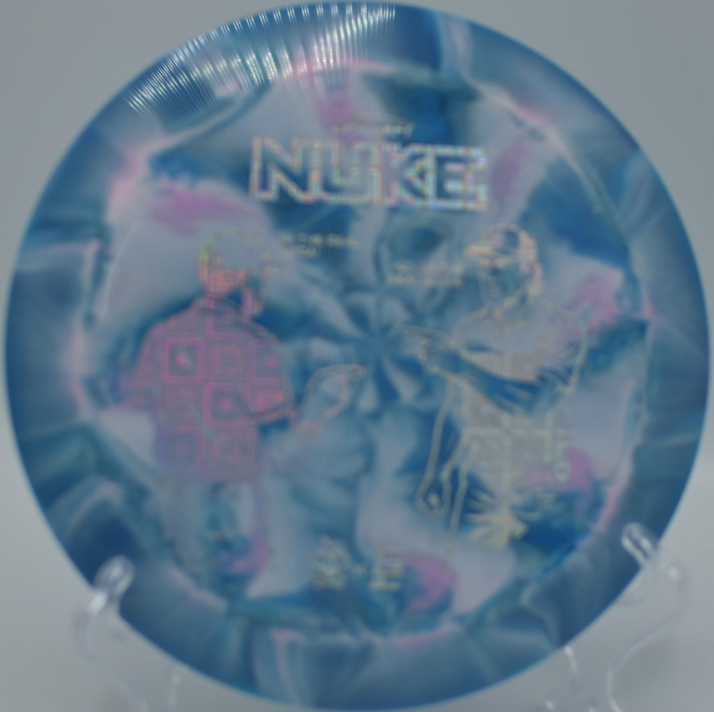 Ezra Aderhold & Robinson ESP Nuke Collaboration resting near the pin after a huge forehand bomb at Persimmon Ridge Disc Golf Course in Greenbrier, Arkansas.