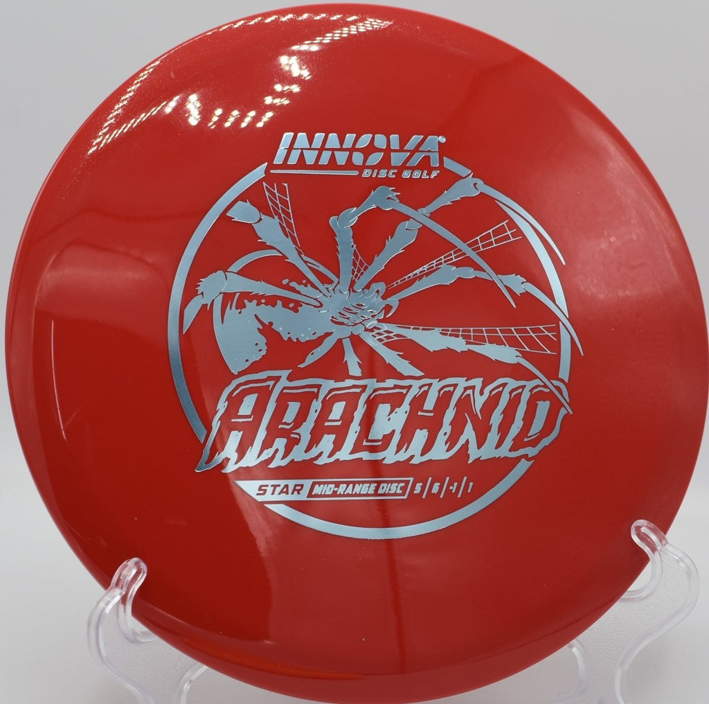 Innova Star Arachnid midrange gliding through wooded fairway gap at Hidden Lake Disc Golf Course in Martinez, Georgia