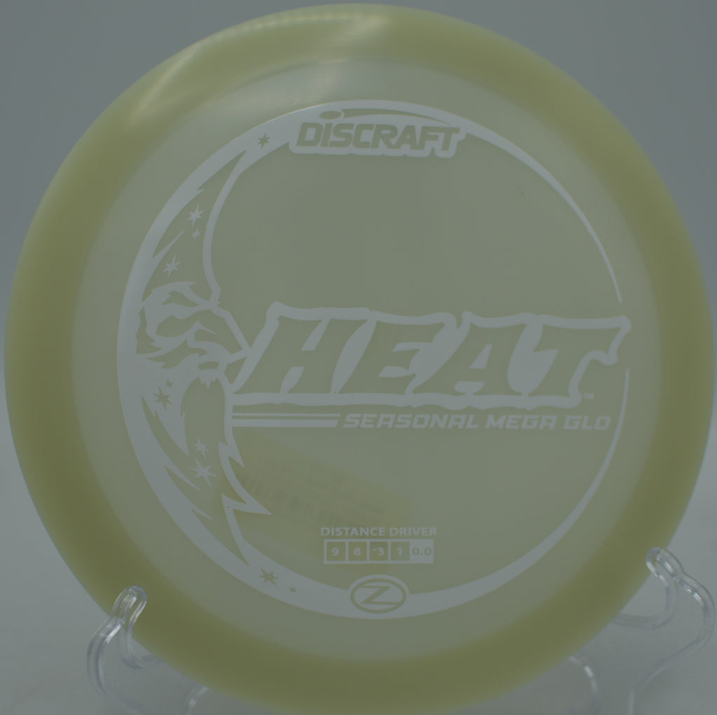 Discraft Mega Glow Seasonal Heat glowing bright on a smooth turnover shot at Morley Field Disc Golf Course in San Diego, California.