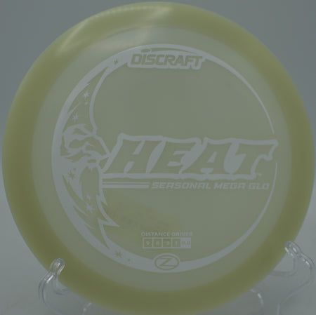 Discraft Mega Glow Seasonal Heat glowing bright on a smooth turnover shot at Morley Field Disc Golf Course in San Diego, California.