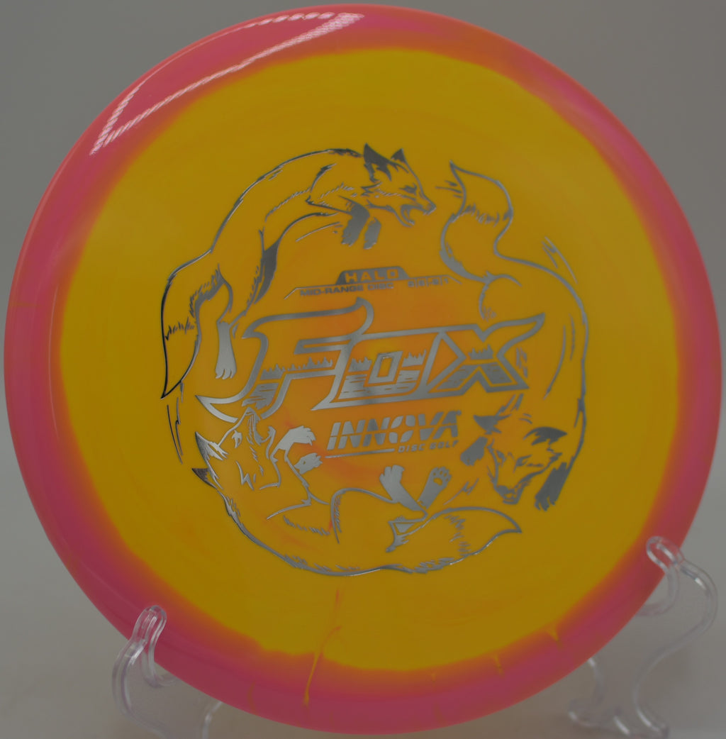 Vibrant Halo Star Fox by Innova spinning across open skies at Waterworks Park Disc Golf Course in Kansas City, Missouri.