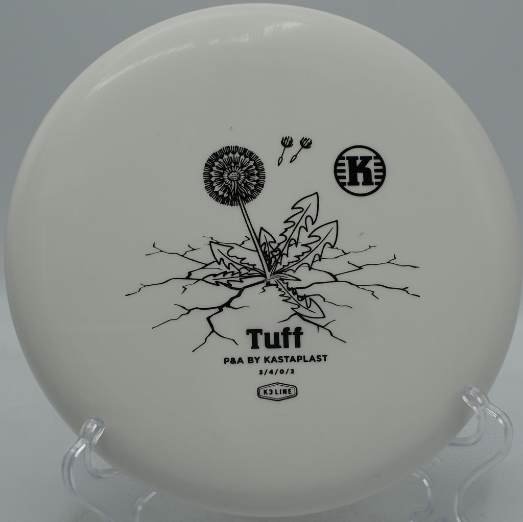 K3 Tuff Kastaplast reliable putter settling beside the pin at DeLaveaga Disc Golf Course in Santa Cruz, California.