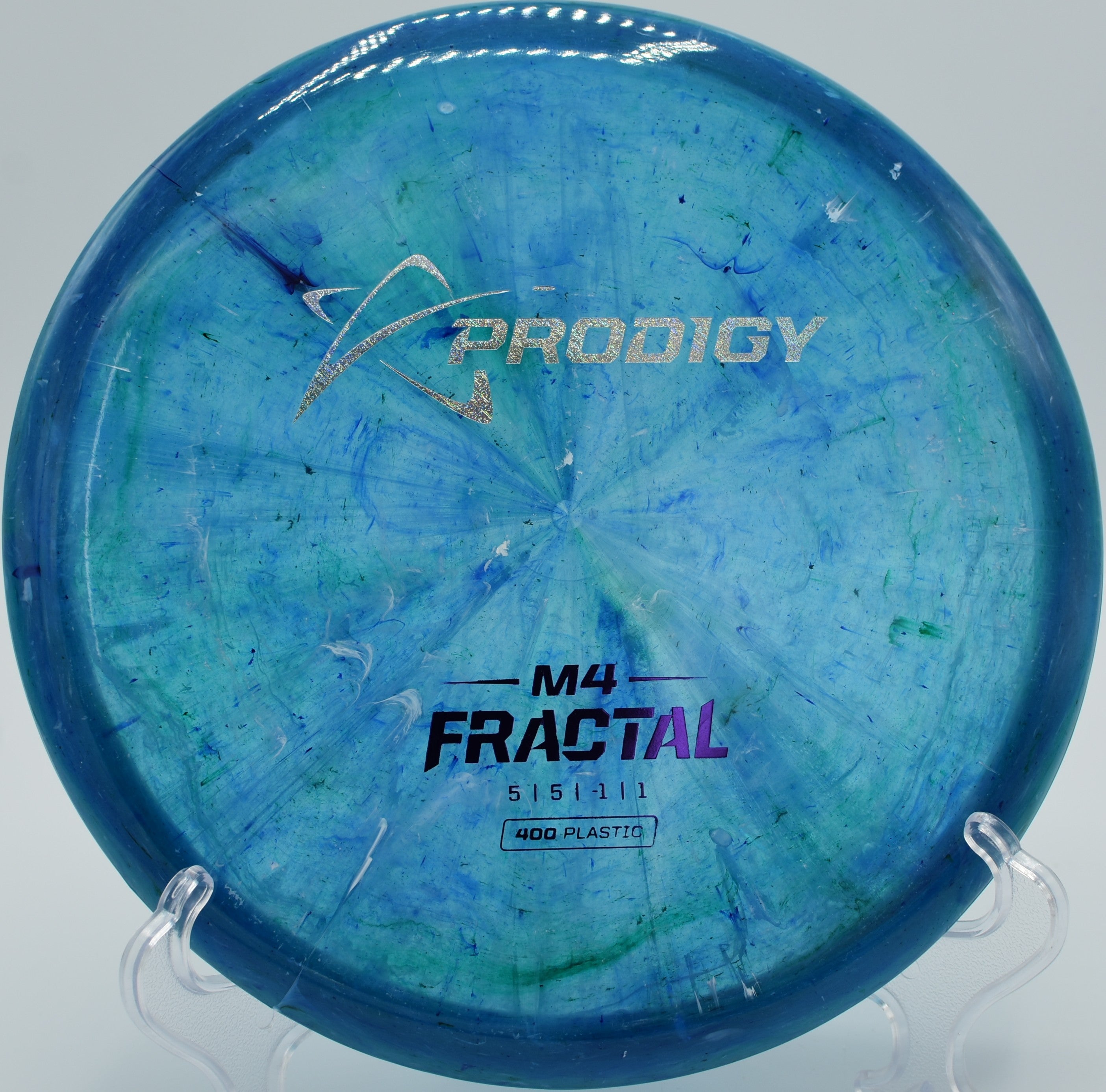 400 Fractal M4 disc golf midrange holding a gentle turnover at Ewing Park Disc Golf Course, Des Moines, Iowa