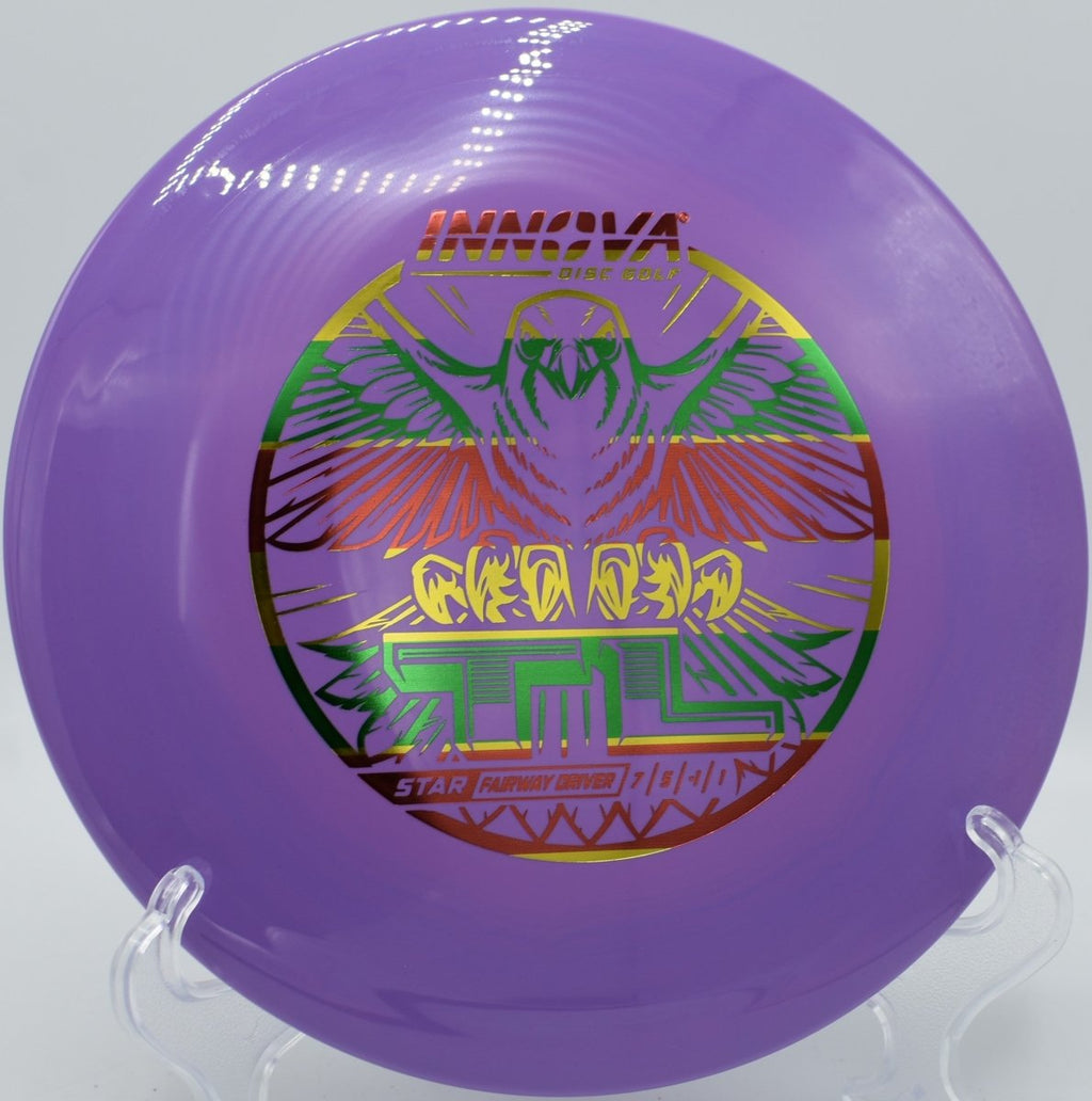 Star TL fairway driver parked under basket after a glidey straight shot at Lake Eureka Disc Golf Course in Eureka, Illinois