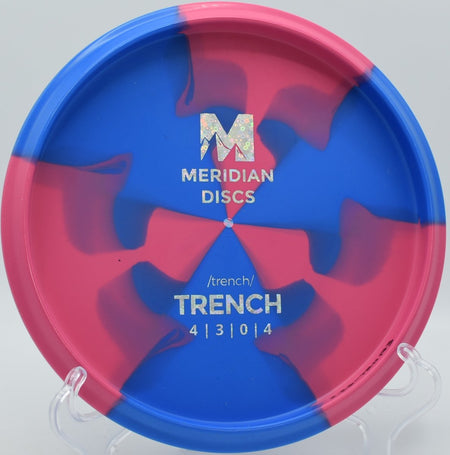 Marbled Graphite Trench fairway driver gliding down a tight fairway line at Rogers Lakewood Park Disc Golf Course in Valparaiso, Indiana