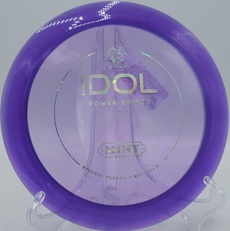 Eternal Idol disc golf driver carving a controlled turnover line at Northwood Black Disc Golf Course in Morton, Illinois