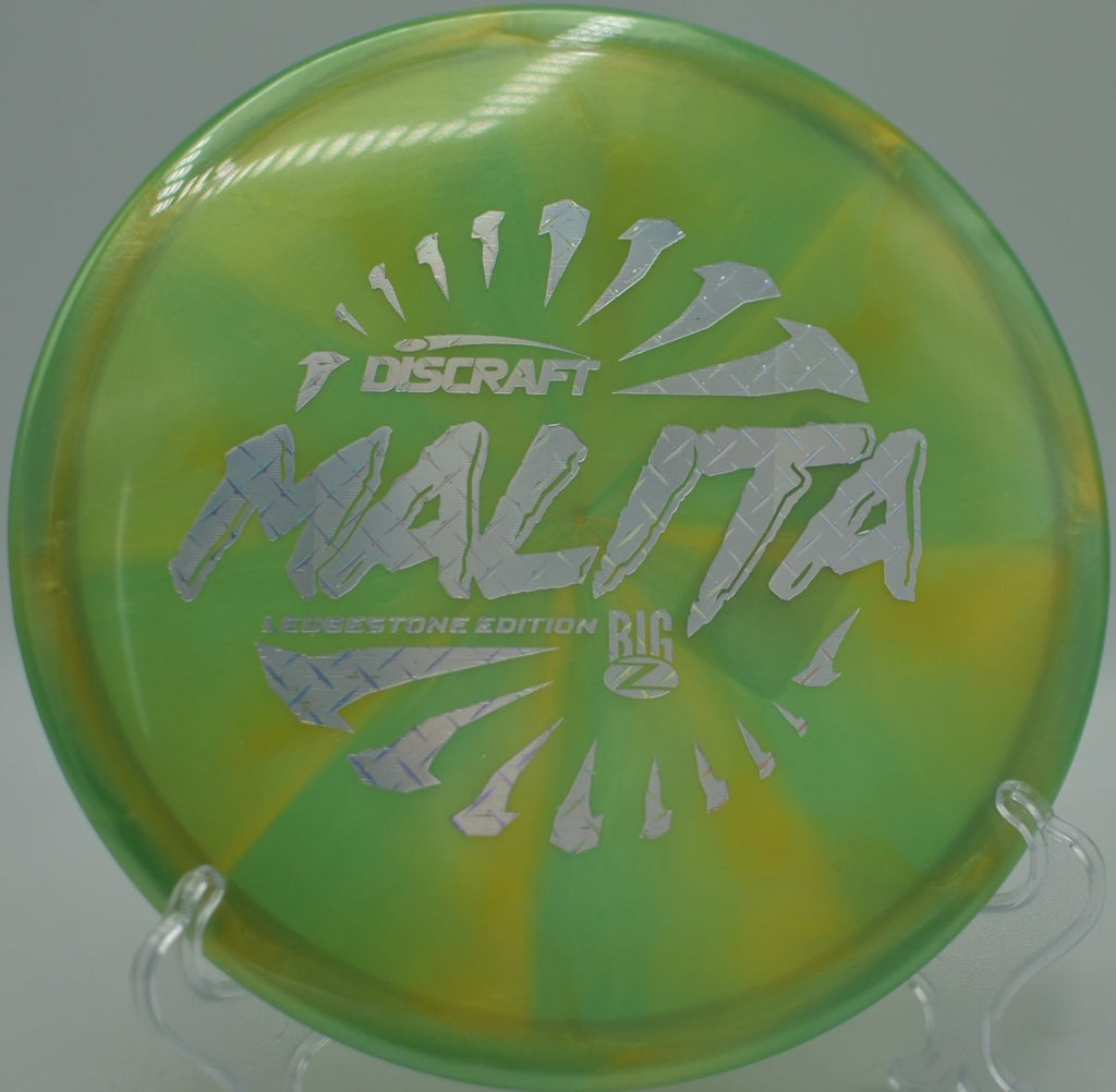 2026 Ledgestone Big Z Swirl Malita midrange gliding through technical woods at Fort Steilacoom Disc Golf Course in Lakewood, Washington