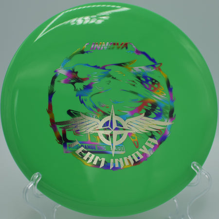 Player throwing a Star Jay Team Stamp on a smooth backhand line through the woods at Harmon Hills Disc Golf Course in Fall Branch, Tennessee.