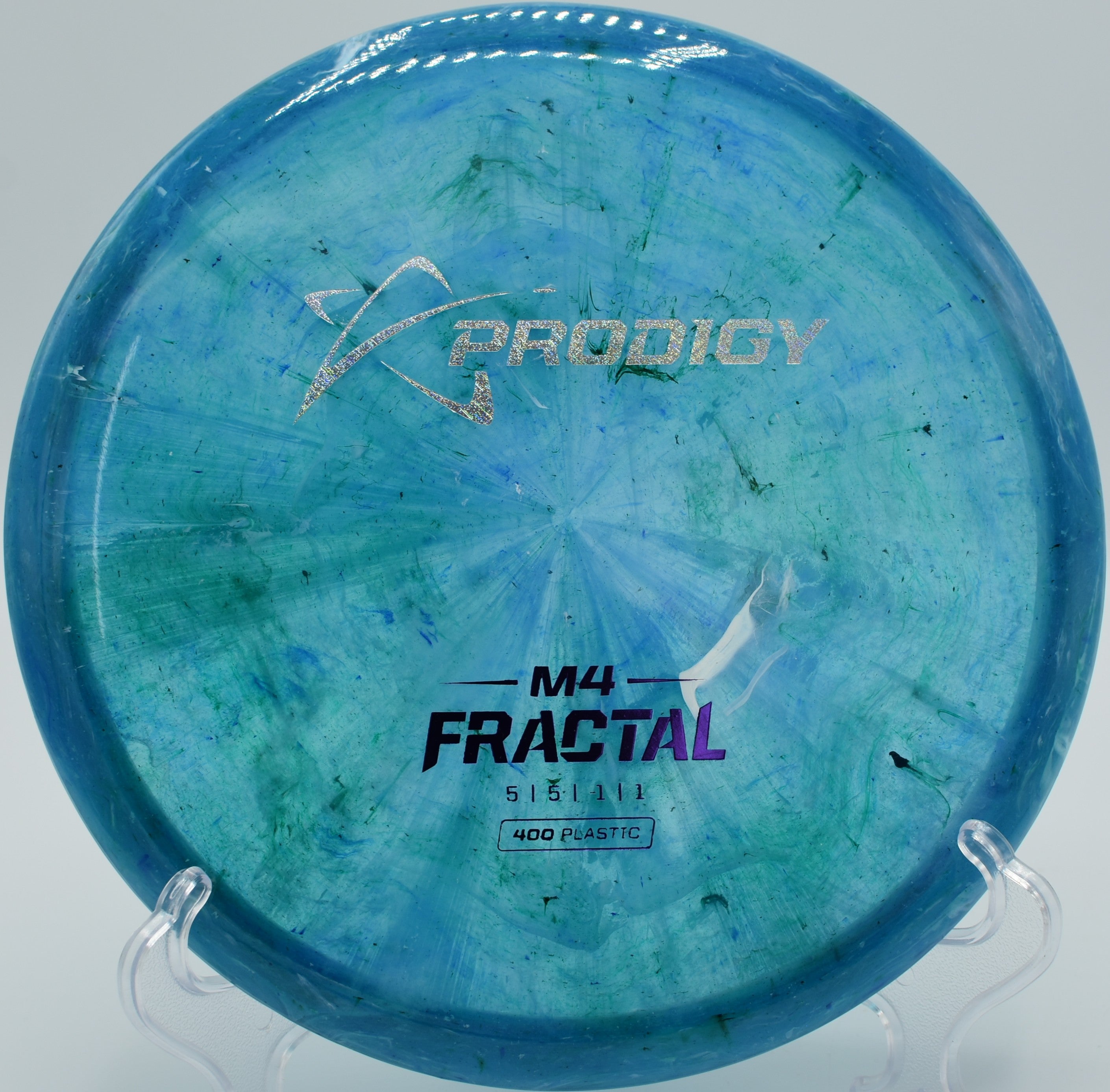 400 Fractal M4 disc golf midrange floating toward the basket at Schumaker Pond Disc Golf Course, Salisbury, Maryland