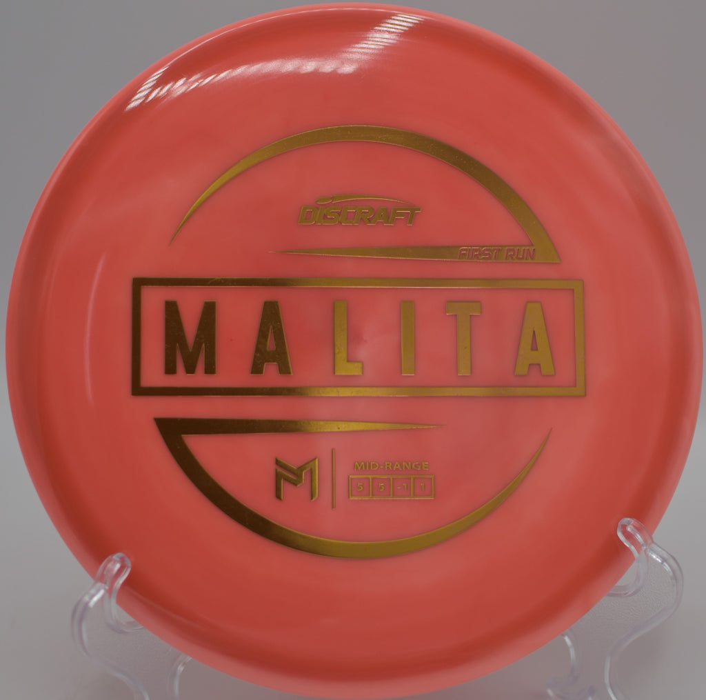 Discraft ESP Malita gliding through a wooded fairway at Avon Town Hall Park Disc Golf Course in Avon, Indiana.