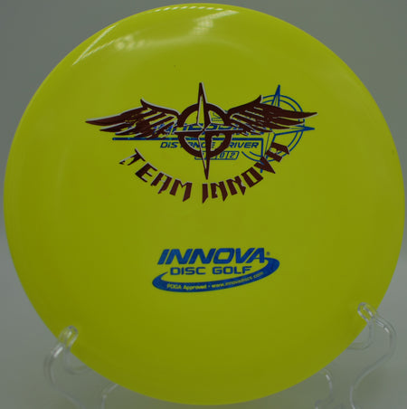 Player launching a Star Thunderbird Team Stamp on a controlled hyzer line at Maple Hill Disc Golf Course in Leicester, Massachusetts.