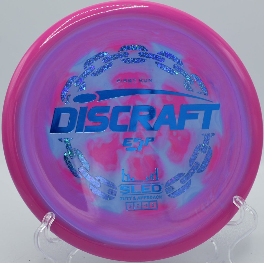 Discraft First Run ESP Sled finesse putter upshot near chains at Tyler State Park Disc Golf Course in Newtown, Pennsylvania