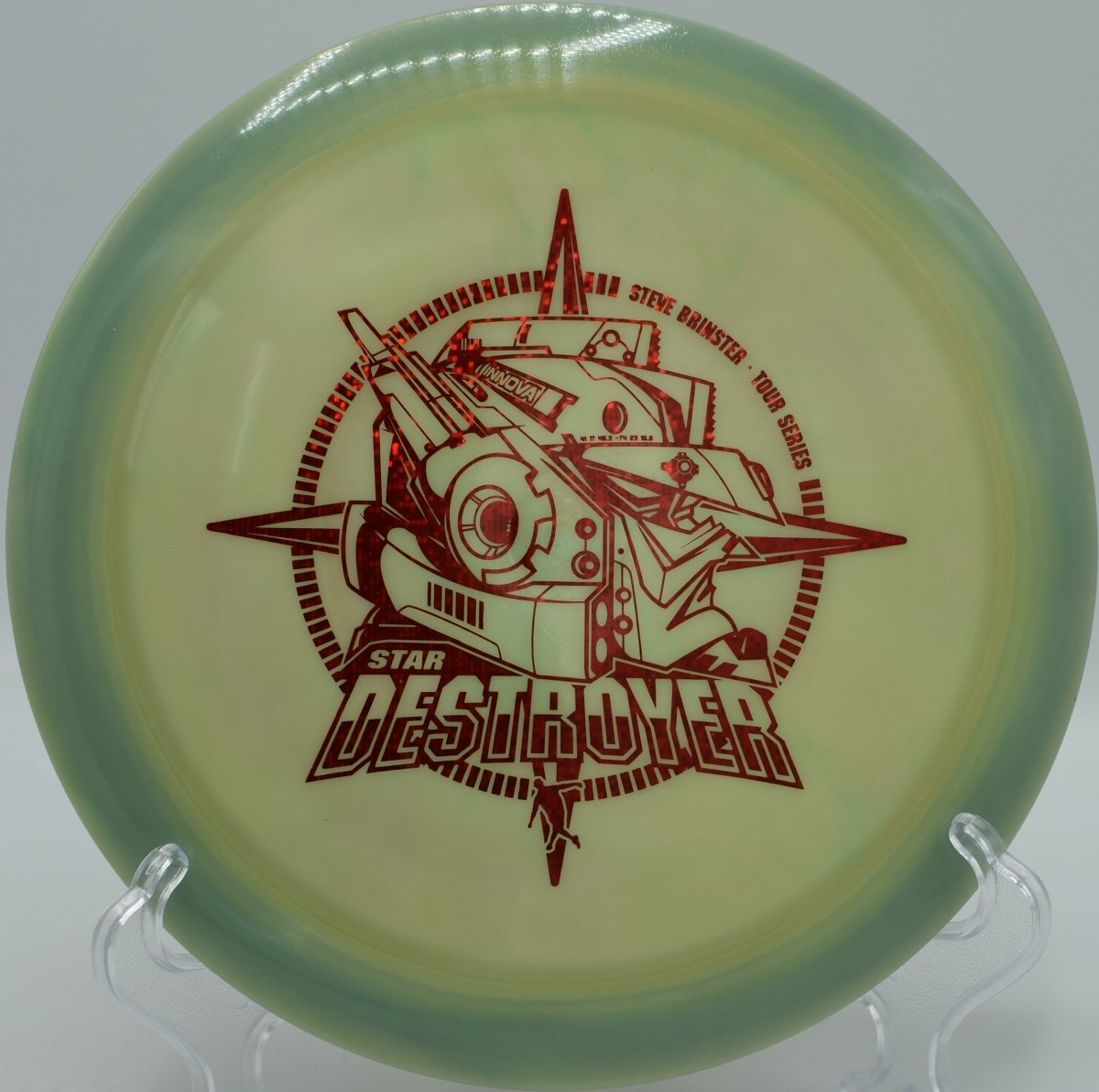 Brinster Star Destroyer driven low and hard into open air at Buffalo Ridge Disc Golf Course in Cedar Hill, Texas, maintaining wind-fighting overstability, forward push, and a crushing late finish for power-focused disc golf shots