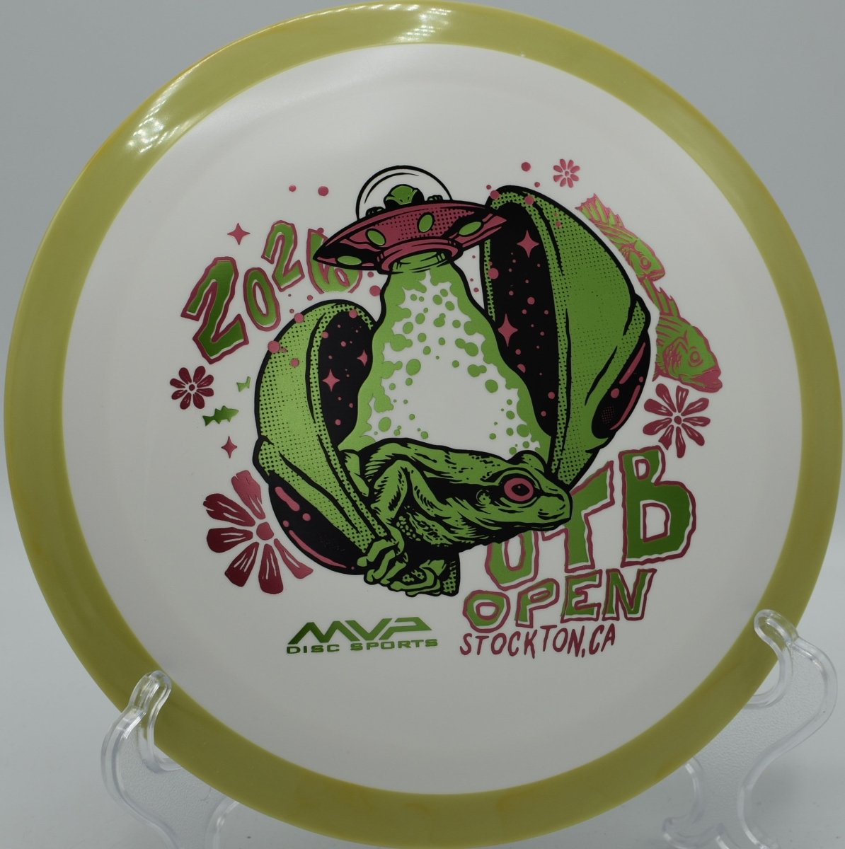 Axiom Delirium Fission OTB Open edition driver resting in fairway grass at Diavolo Disc Golf Course in Cary, North Carolina