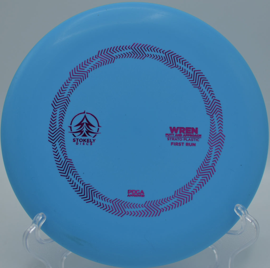 Stokely Discs Strato Wren floating toward the target at Addison Oaks County Park Disc Golf Course in Leonard, Michigan.