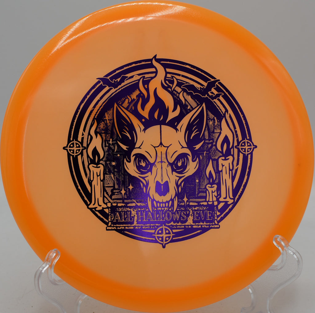 Glow Champion Fox disc flying a long hyzer-flip at Valley Springs Disc Golf Course in Durham, North Carolina