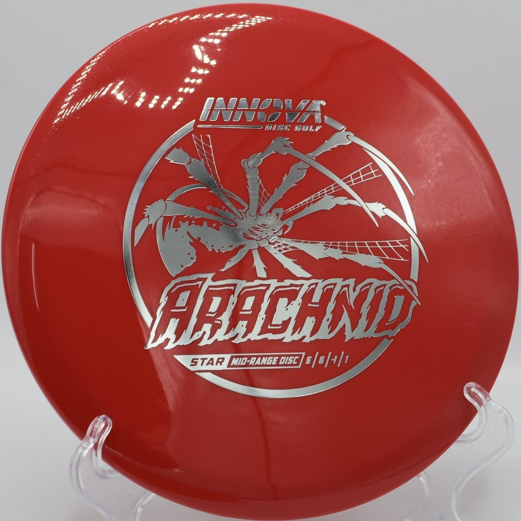 Innova Star Arachnid midrange resting beside basket pole after a straight approach at Murray Park Disc Golf Course in Little Rock, Arkansas