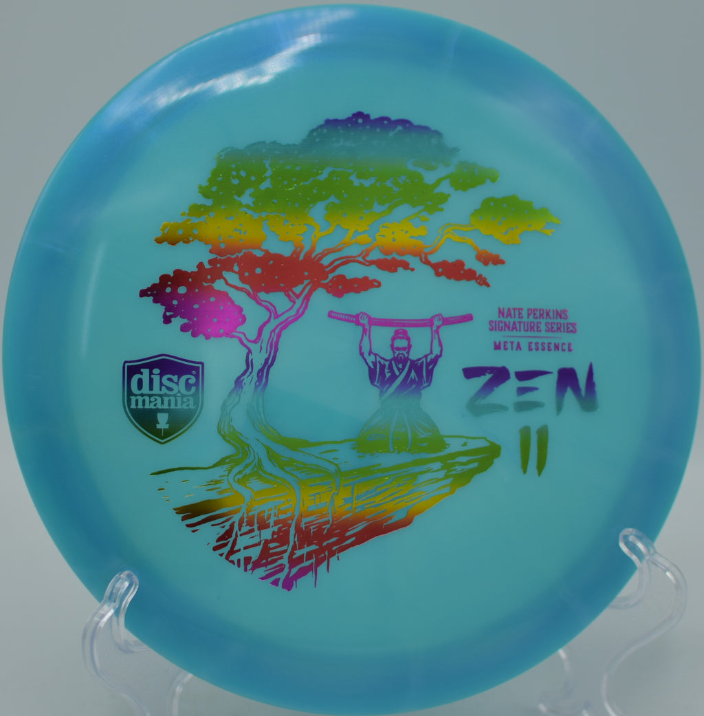 Discmania Meta Essence Zen 2 control driver turning gently through wooded gaps at Persimmon Ridge Disc Golf Course in Greenbrier, Arkansas.