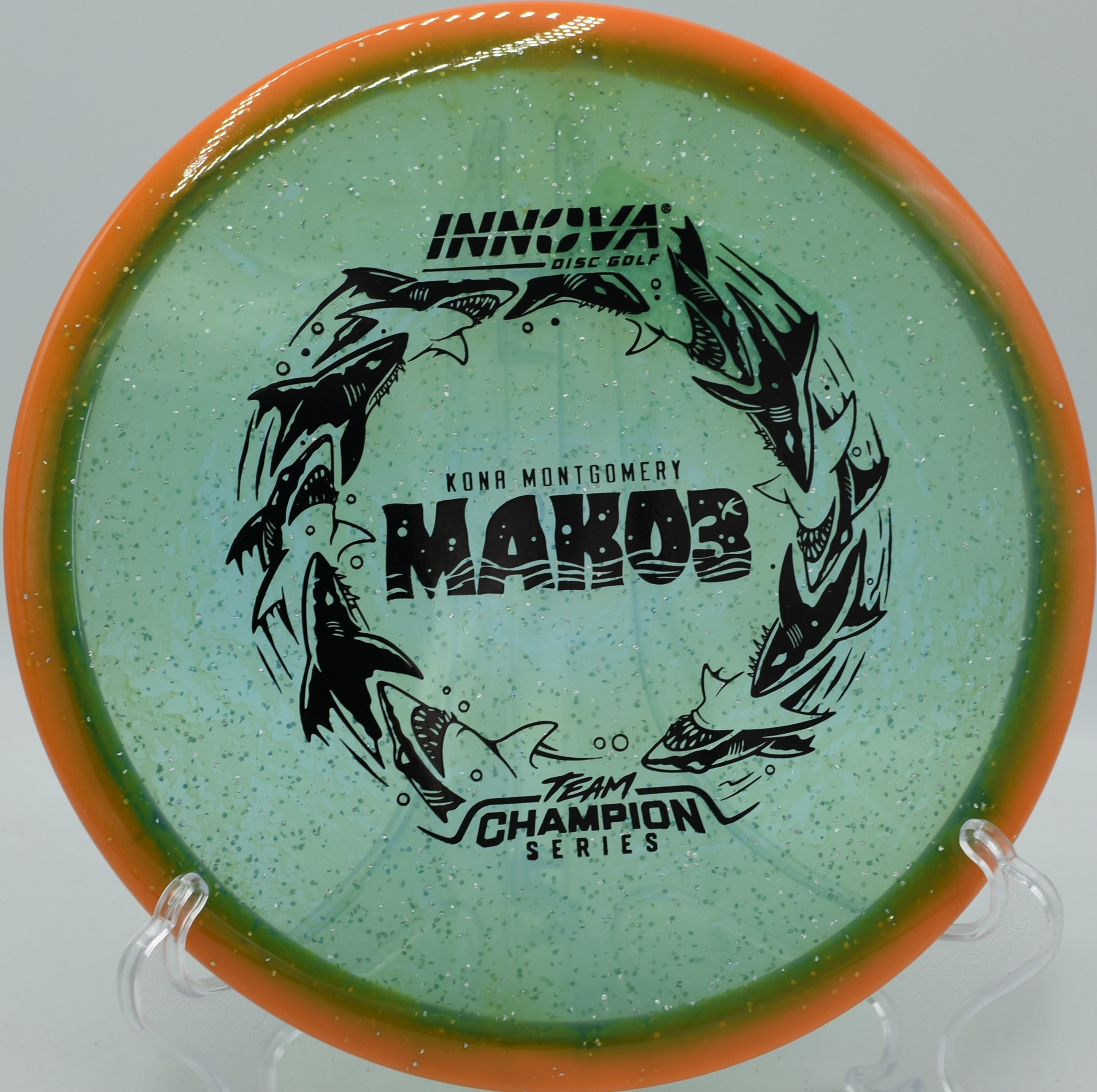 Innova Halo Champion Metal Flake Mako3 midrange gliding forward at Coyote Point Disc Golf Course in San Mateo California