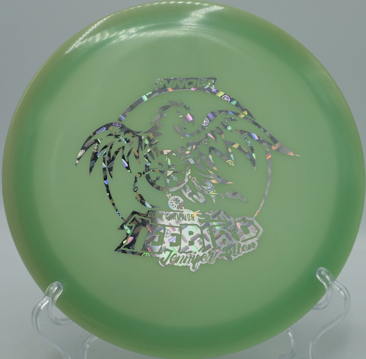 2017 Jennifer Allen Glow TeeBird fairway driver glowing on a flat, controlled line at Blue Lake Disc Golf Course in Fairview, Oregon, holding straight stability with steady glide and a dependable fade for confident night-golf tee shots