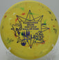 Discraft Zone in Jawbreaker plastic nestling up under the basket at Harmony Bends in Columbia, Missouri