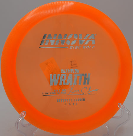 Champion Wraith distance driver carving a controlled S-curve at Northwood Black Disc Golf Course in Morton, Illinois