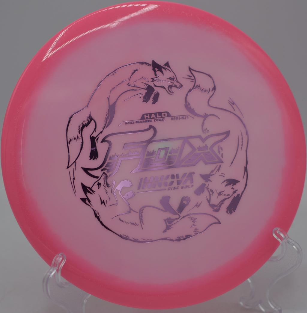 Innova Halo Star Fox gliding past trees on a downhill fairway at Milo McIver State Park Disc Golf Course in Estacada, Oregon.