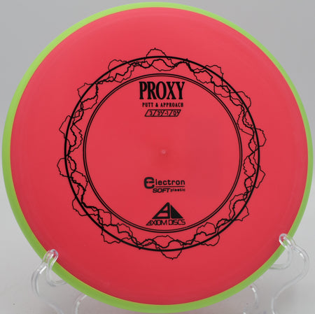 Axiom Electron Soft Proxy point-and-shoot putter parked under chains at DeLaveaga Disc Golf Course in Santa Cruz, California.