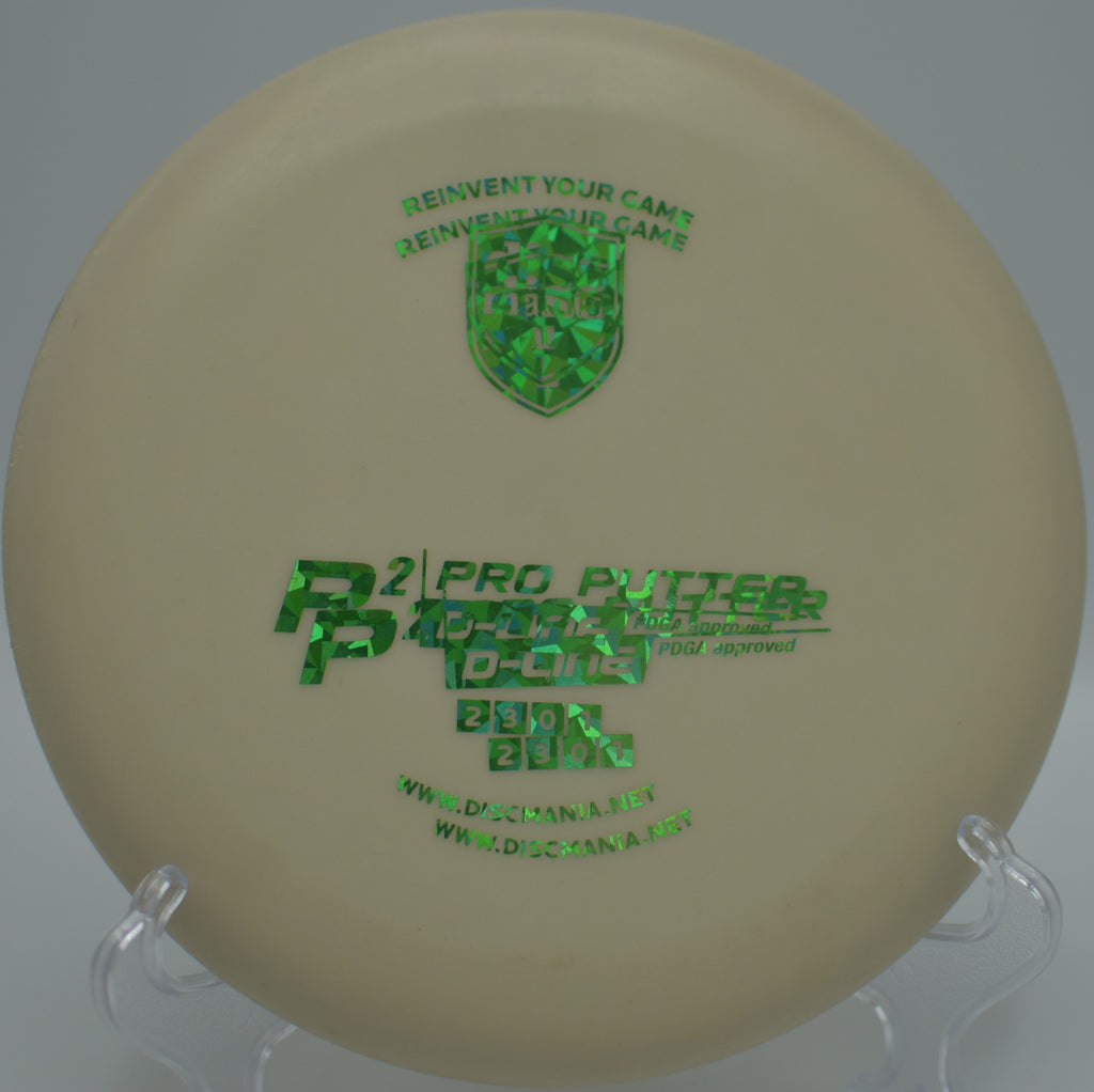 D-Line P2 (Innova Made) resting on the green after an accurate approach at Ralph Stover State Park Disc Golf Course in Pipersville, Pennsylvania.