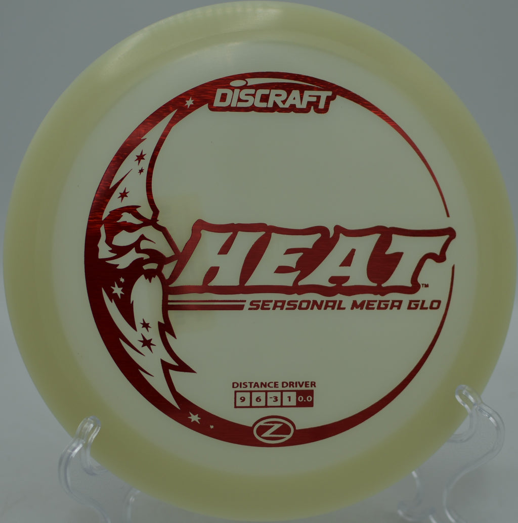 Understable Discraft Mega Glow Heat carving through trees during a glow round at Blue Ribbon Pines Disc Golf Course in East Bethel, Minnesota.