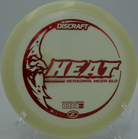 Understable Discraft Mega Glow Heat carving through trees during a glow round at Blue Ribbon Pines Disc Golf Course in East Bethel, Minnesota.