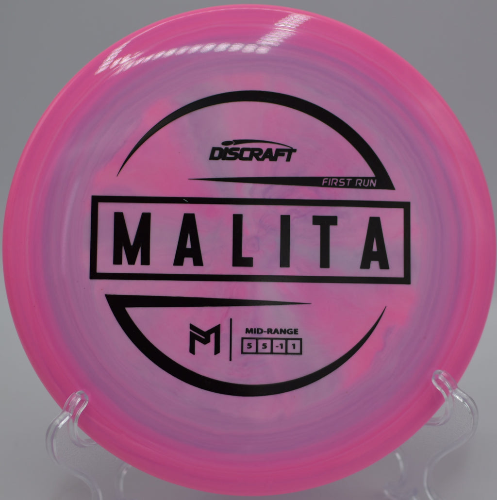 Paul McBeth First Run Malita floating down a narrow fairway with gentle fade at Moser Park Disc Golf Course in New Haven, Indiana.