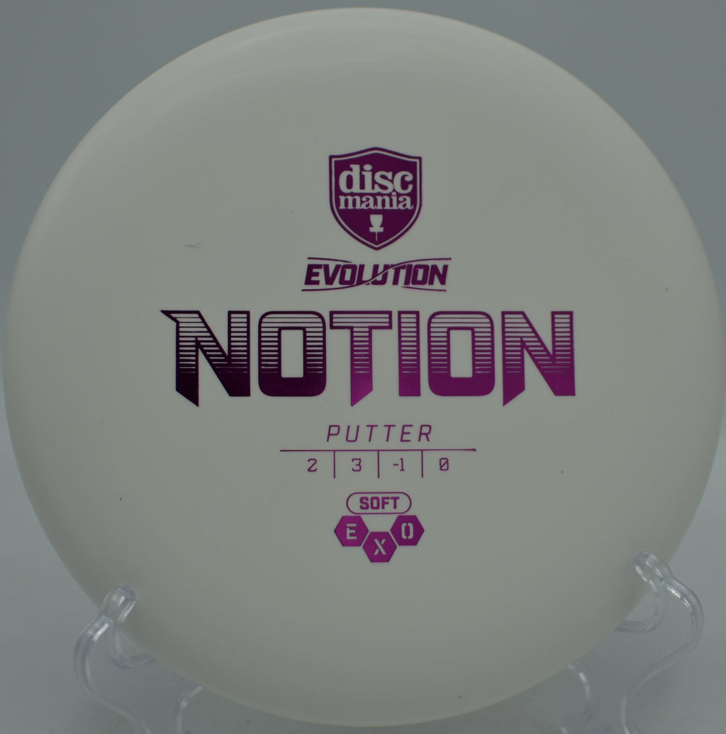 Discmania Exo Soft Notion flying flat through the woods at Idlewild Disc Golf Course in Burlington, Kentucky.