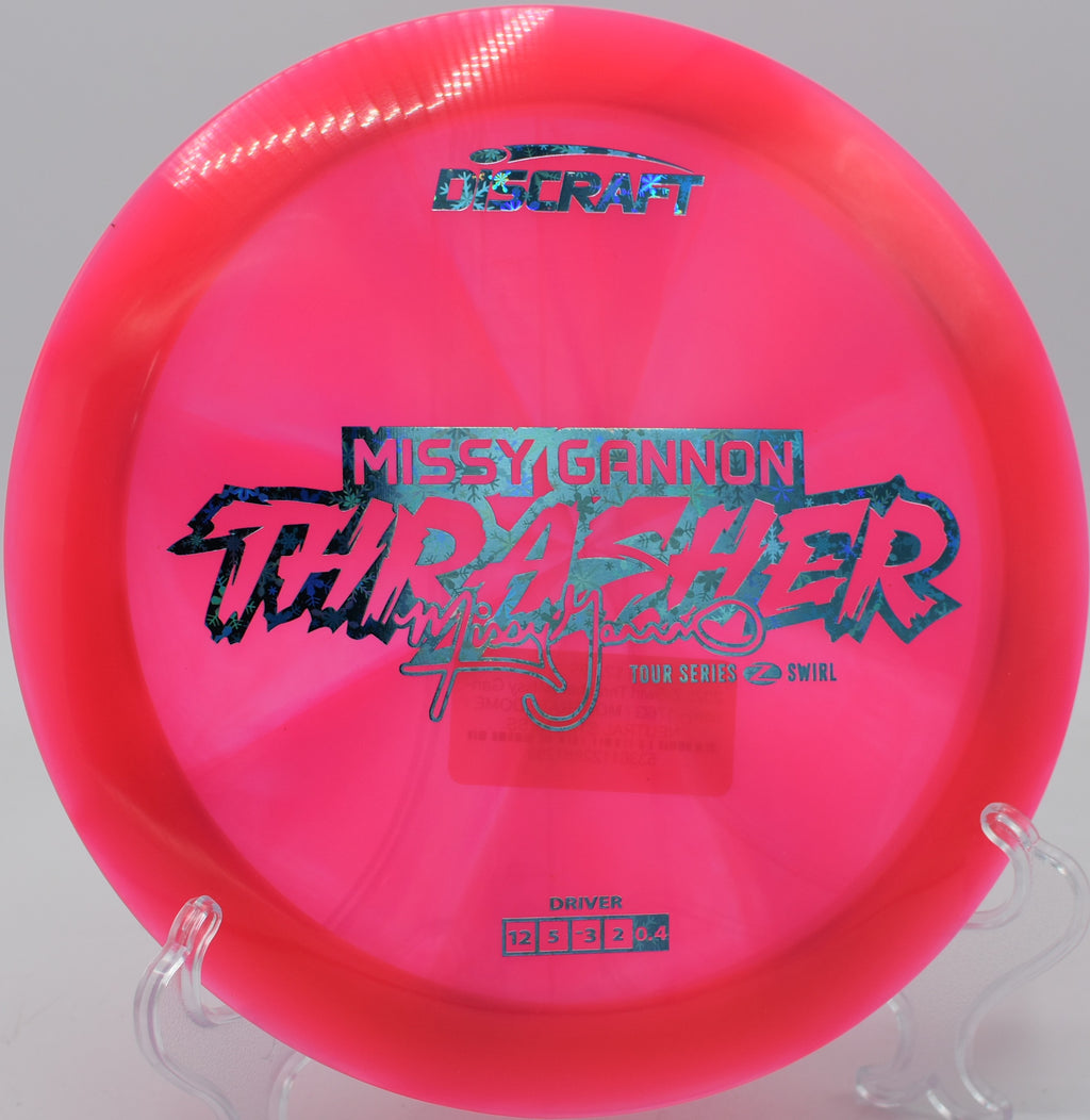 Player reaching back with Z Swirl Thrasher at Rocklin Disc Golf Course in Rocklin, California.

