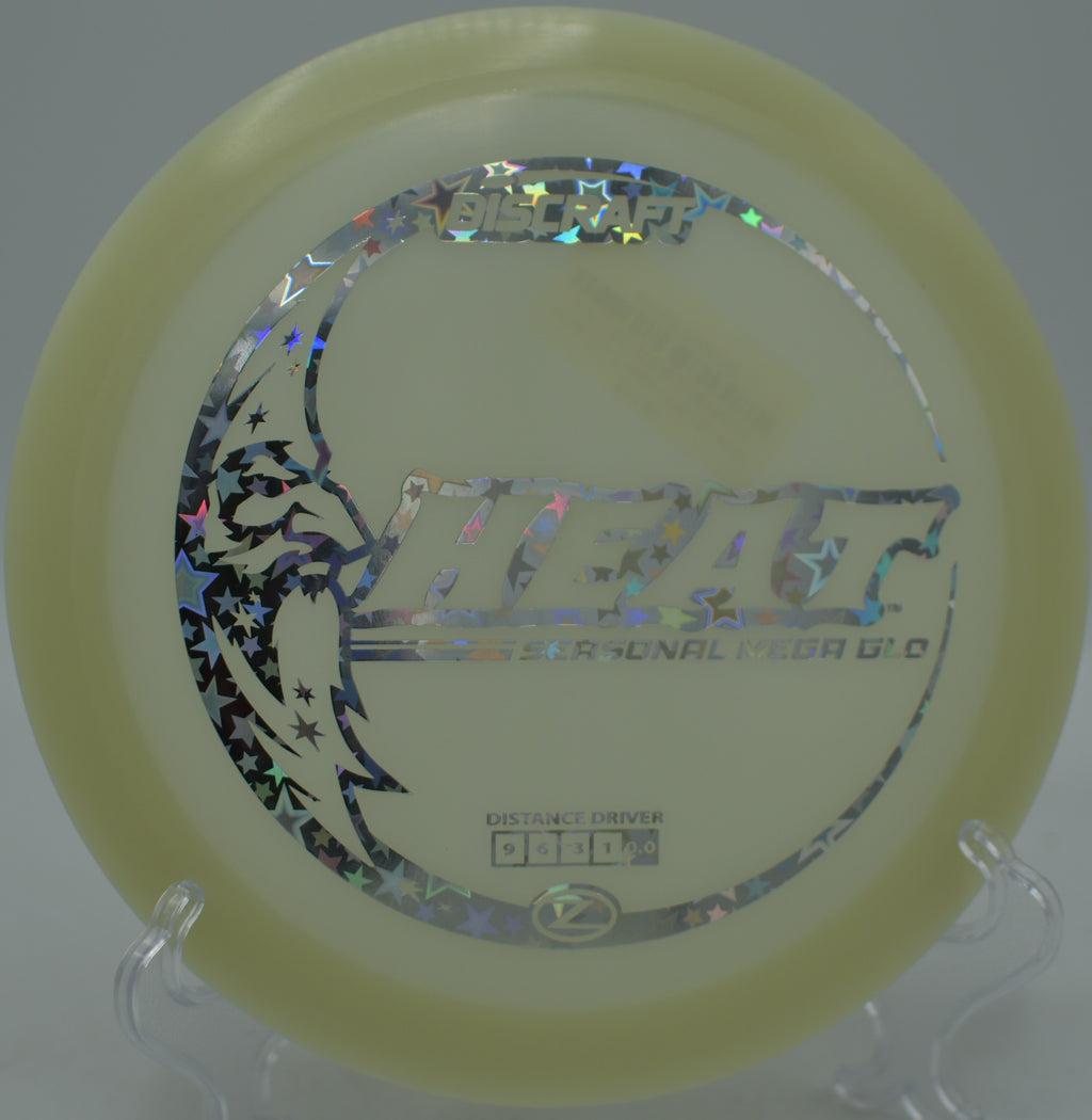 Brightly glowing Heat driver gliding with effortless turnover at Hornets Nest Disc Golf Course in Charlotte, North Carolina.