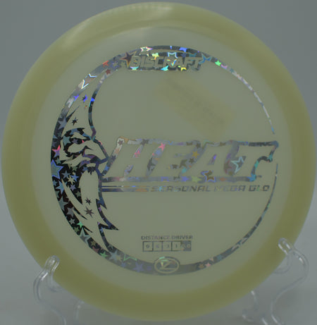 Brightly glowing Heat driver gliding with effortless turnover at Hornets Nest Disc Golf Course in Charlotte, North Carolina.