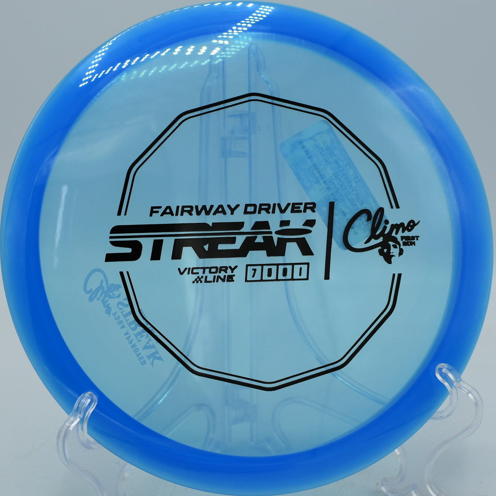 Victory Line Streak hugging the tree line on a tight drive at Veterans Park Disc Golf Course in Arlington, TX