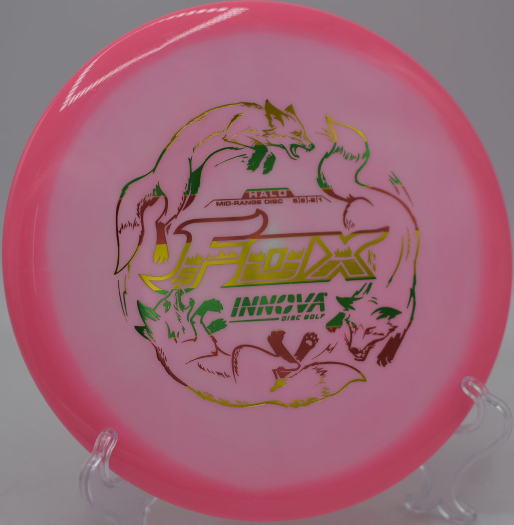 Brightly colored Halo Star Fox flying with clean release and soft fade at Maple Hill Disc Golf Course in Leicester, Massachusetts.
